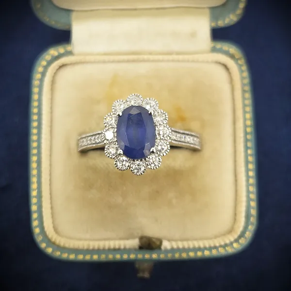 Diamond and Sapphire Ring in 18ct White Gold-large-sapphire-cluster-in-white-gold-with-milgrain.webp