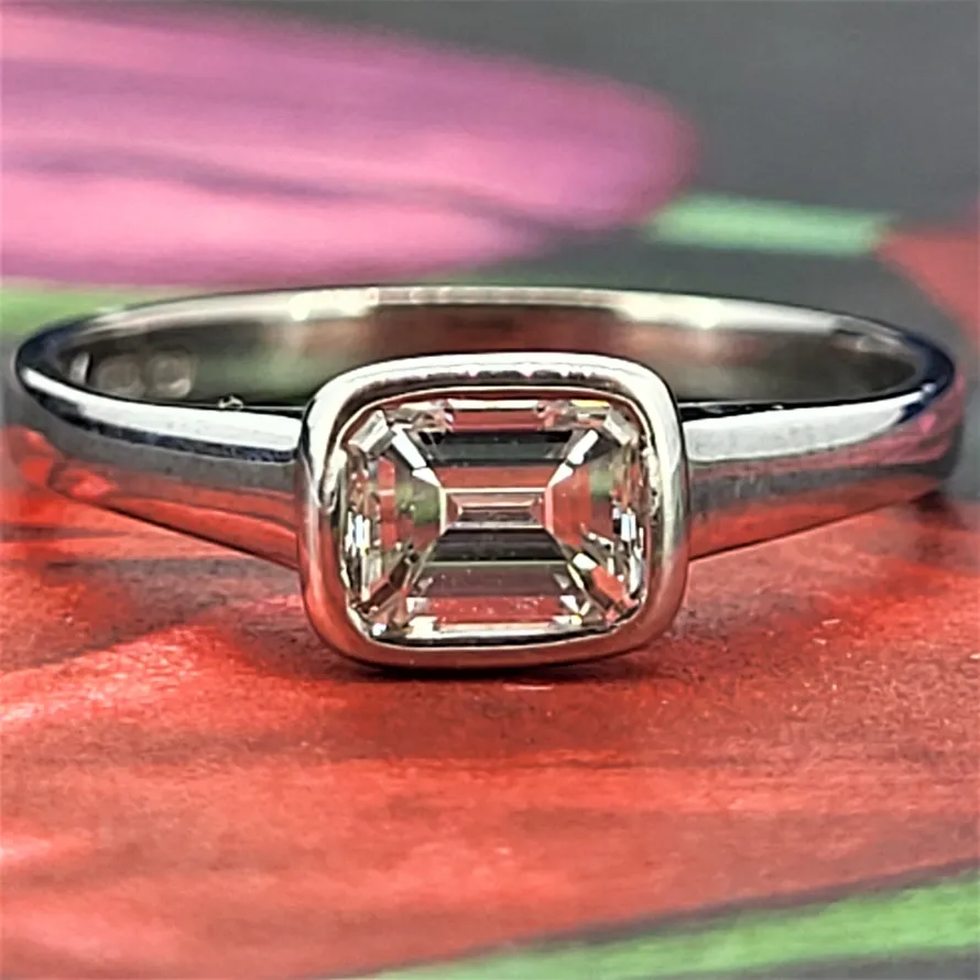 Platinum Emerald Cut Solitaire 0.56cts-pinky-emerald-ring.webp