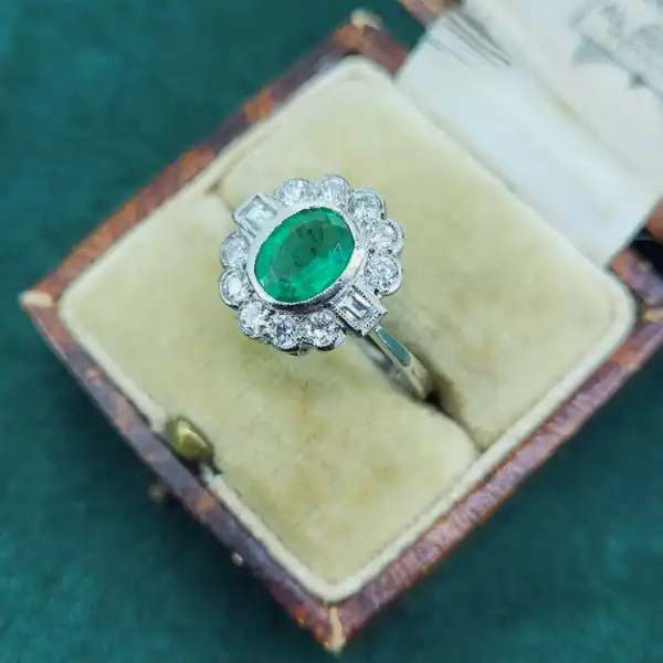 Emerald and Diamond Ring in Platinum-platinum-emerald-and-diamond-art-deco-cluster-ring.webp